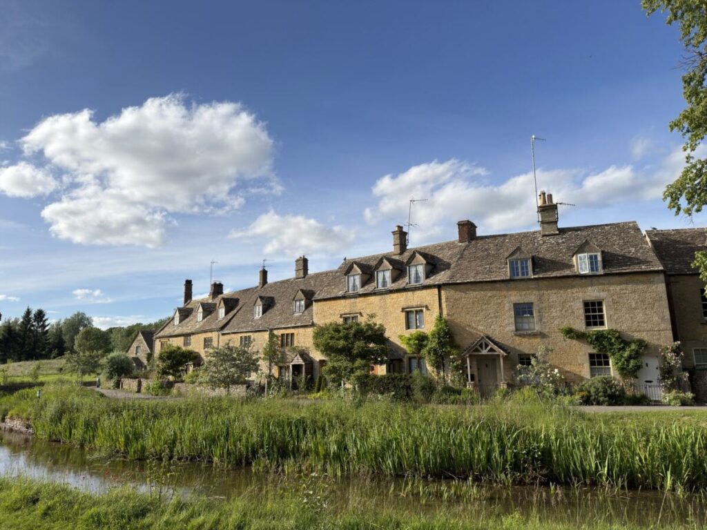 Momentum Markers April-June 2026, Cotswolds village of golden stone houses in the English countryside