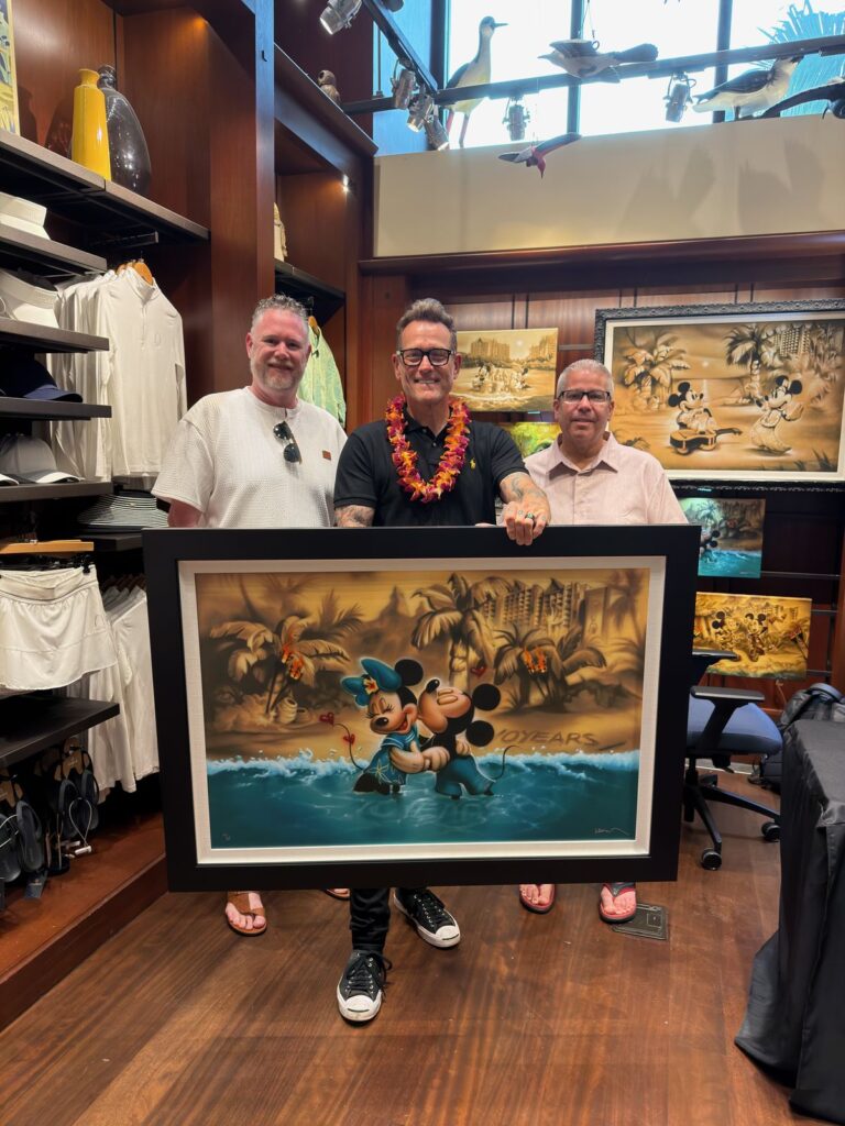 Noah Elias at the Noah Fine Art event at Aulani with Mickey and Minnie Hawaii artwork